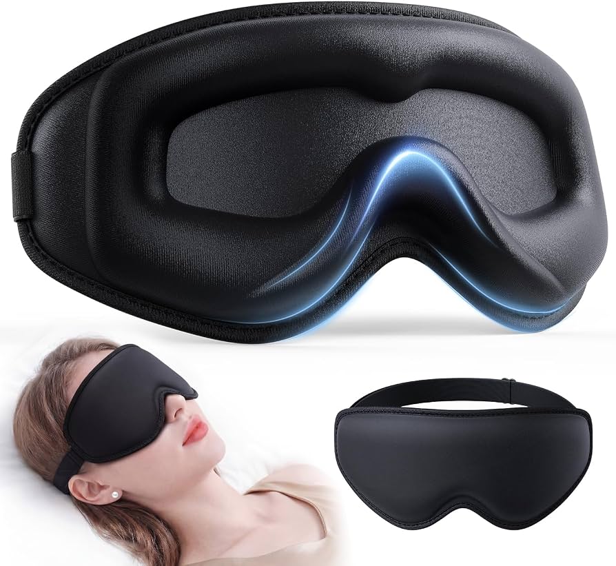 Black sleep mask showing the contoured eye area and adjustable head strap.
